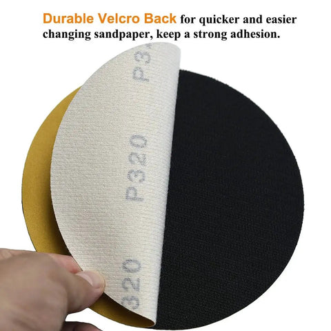 Close-up of 6-Inch No-Hole Hook and Loop Sanding Discs 320 Grit 100-Pack for Automotive showing Velcro back and grain