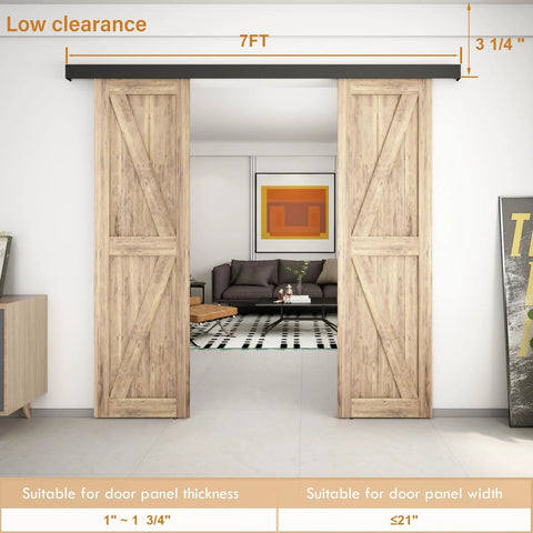 7 Foot Double Sliding Barn Door Hardware Kit With Low Clearance Aluminum Box Rail, Quiet Glide Silent Track For Wooden Double Barn Doors, No Fuss Install, Black Finish, Durable Rust Resistant shown installed in a living room setting.