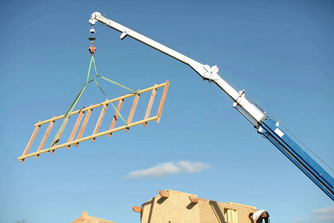 Everest C1150 1in x 3ft flat endless lifting sling, yellow, hoisting a wooden beam with a crane