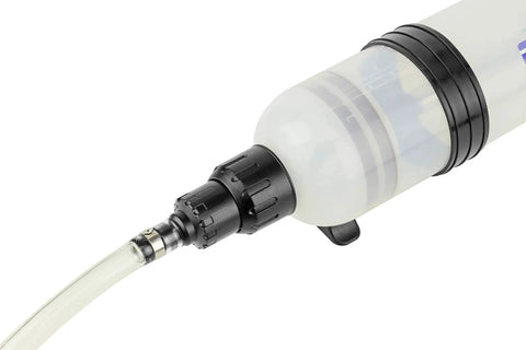 Close-up of 1.5 Liter Fluid Evacuator and Dispensing Syringe with Twist Valve ATF Adapter, showing transparent syringe tip.