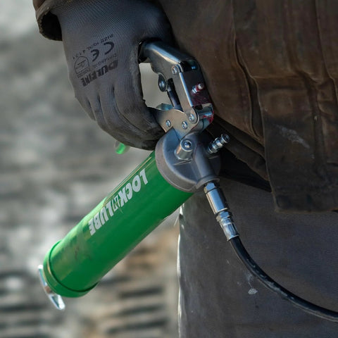 LockNLube heavy-duty pistol grip grease gun with green barrel and 20-inch hose with inline swivel.