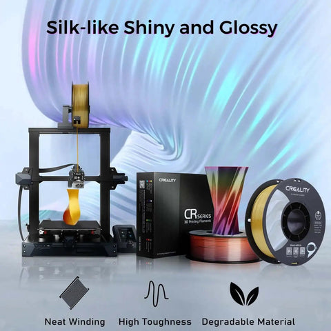 3D printer setup with Multi Color Silk PLA Filament 1.75mm For 3D Printing, Dope Gloss Silk Finish, Blue Green spool and packaging.