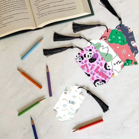 Five Set Of Thirty Six Bookmark Die Cuts And Tag Dies With Embossing Stencils For Scrapbooking with colored pencils on table