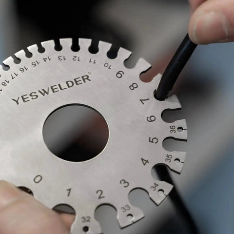 Round Dual Sided Metal Sheet Gauge And Thickness Gauge 2 Pack Pro Grade Stainless Steel Welding Gauge in use measuring wire