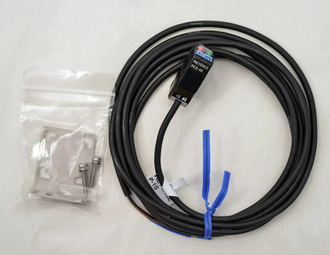 Keyence PZ2-42 Diffuse Reflective Short Range Photoelectric Sensor With Red LED Detects Transparent And Opaque Targets 100 mm Range New In Box Ready To Install Must Have, shown with attached cable and mounting kit.