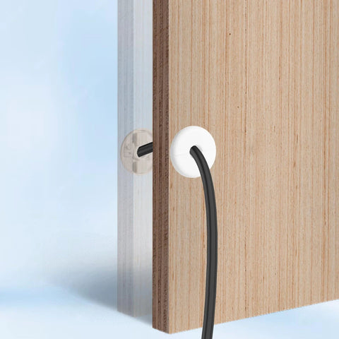 Thinp white wall cable grommets, 4-pack, with black cable passing through a wooden panel.