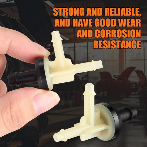 Two beige plastic vacuum check valves for automotive vacuum lines.