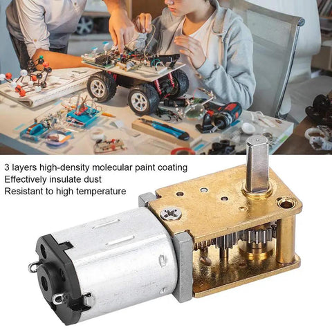 Mini Gear Motor 6V 35 RPM High Torque Brush DC Gear Motor on table with DIY robotics project in background