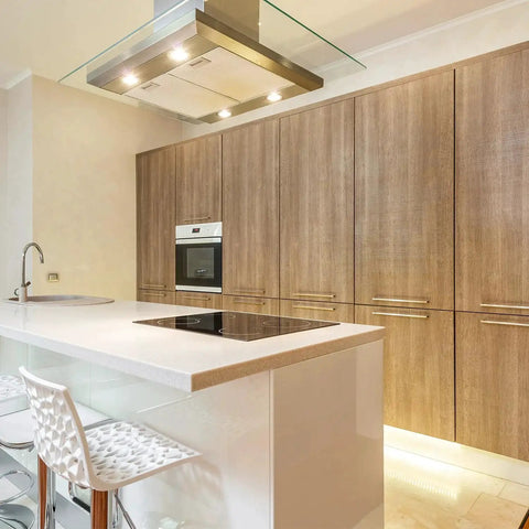 Modern kitchen with 10 Pack Square Cabinet Pulls 10 Inch Brushed Brass Gold on wooden cabinets and sleek white counter.