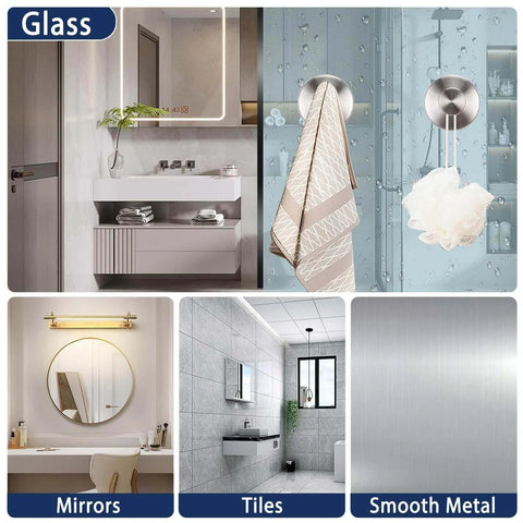 Bathroom interiors showing glass, mirrors, tiles, and smooth metal surfaces with sleek modern design.