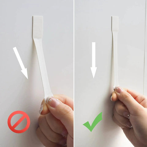 Demonstration of adhesive strips installation with correct and incorrect steps shown for Clear Wall Hooks With Adhesive Strips 15 Hooks 30 Strips No Tools Damage Free.