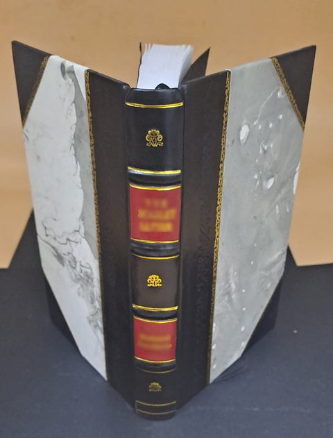 Front view: Leather-bound book on regenerative braking; black spine with red title panels and gold bands.