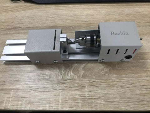 Handy Compact Wood Lathe For DIY Projects In Your Home Workshop Tabletop Mini Lathe For Wood Turning 24V DC 100W 7 Speeds Aluminum Alloy Acrylic Construction Portable 310x60x70mm Includes 3 Hex Shanks By BACHIN on tabletop