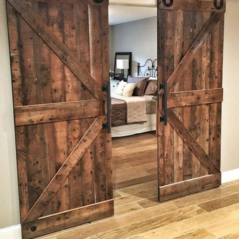 16 Inch Square Sliding Barn Door Handles Set Of 2 Black Matte Iron Gate Pulls installed on wooden barn doors indoors
