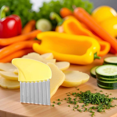 Yellow Stainless Crinkle Cutter For Veggies And Fries Strong Long Lasting Potato Carrot Chip Slicer Durable Kitchen Gadget With Ergonomic Handle Great For Home Cooking Camping And Outdoor Grilling Easy Wave Slices cutting potatoes on wooden board surrounded by vegetables.