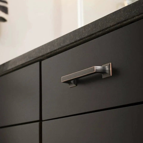 Studio Collection Cabinet Pull Three Inch Center To Center Oil Rubbed Bronze Highlighted Finish on dark kitchen cabinet
