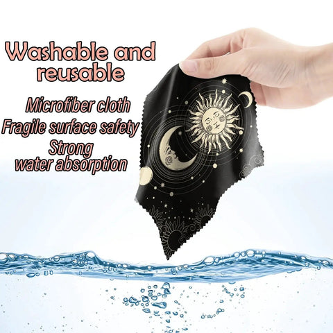 Hand holding Six Pack Microfiber Cleaning Cloths For Eyeglasses And Devices Moon Star Pattern, showing design and water absorption.