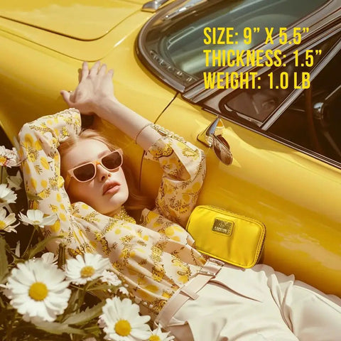 Woman in sunglasses lying next to a yellow car with a yellow car first aid kit, daisies in foreground