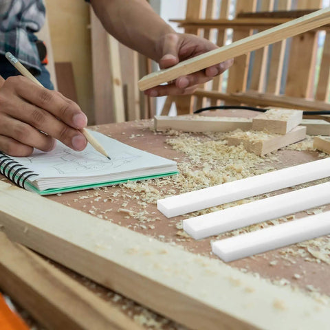 4 Pcs UHMW Precision Milled Bar For Jigs Crosscut Sled For Table Saw Sled Fixtures Or Miter Slots Three Quarters By Three Eighths Inch 17 Inch Long Miter Bar Slider Gauge Rod For Router And Bandsaw Use, shown on woodworking table with sawdust and carpenter sketching.