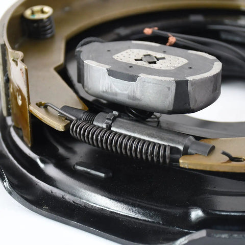 Trailer brake magnet kit, 12-inch, close-up showing gray magnet, coiled spring, and wiring.