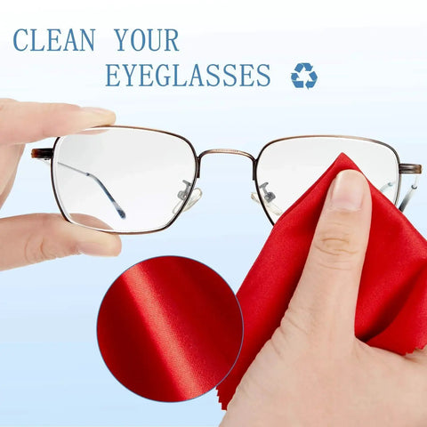 Cleaning eyeglasses with microfiber cloth, from 50 pack, red cloth shown removing smudges, focus on Microfiber Cleaning Cloths For Glasses And Screens 50 Pack 6x7 Inches