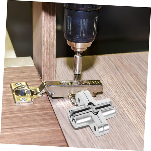 Invisible Folding Door Hinge Kit For Secret Doors Easy To Install Cross Hidden Hinges being installed in a wooden panel