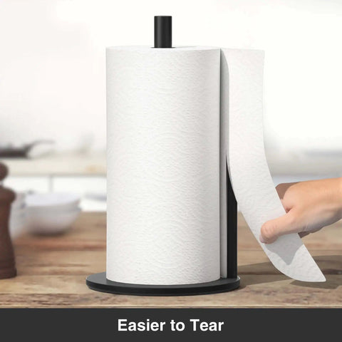 Matte Black Stainless Steel Paper Towel Holder With Weighted Base, hand tearing towel easily, on kitchen counter.