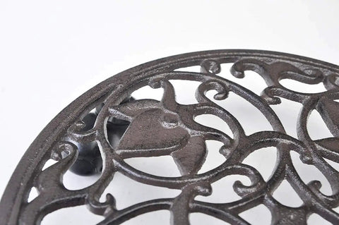 Close-up of the Heavy Duty Cast Iron Plant Stand On Wheels For Indoor And Outdoor Use, intricate cast iron design visible.