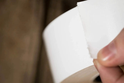 Close-up of White Duct Tape Roll 1.88 Inch By 20 Yards Heavy Duty For Repairs Crafting And Temporary Floor Marking Removable Cleanly Up