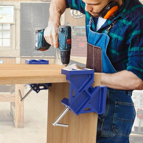 Heavy Duty Cast Iron Welder's Angle Clamp For Precise 90 Degree Joints in use, holding wood panel in workshop setting