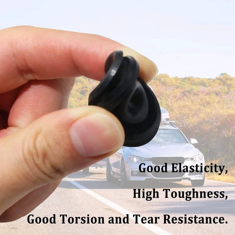 Person holding Trailer Hub Cap Rubber Plugs 20 Pack 1.98 Inch Dust Caps in front of car on highway.