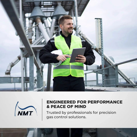Technician with tablet at industrial site for Workhorse Three Quarters Inch NPT Natural Gas Regulator NMT NGR02 75