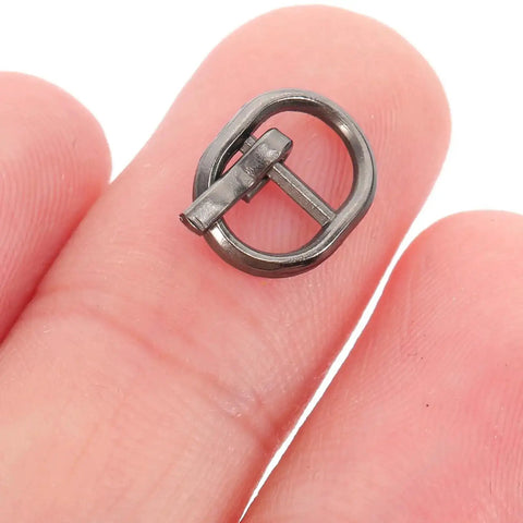 Close-up of a tiny alloy buckle for 150 Pcs Mini Alloy Buckles For Doll Clothes And Belts Tiny Sewing Buckles In Silver Gunmetal And Antique