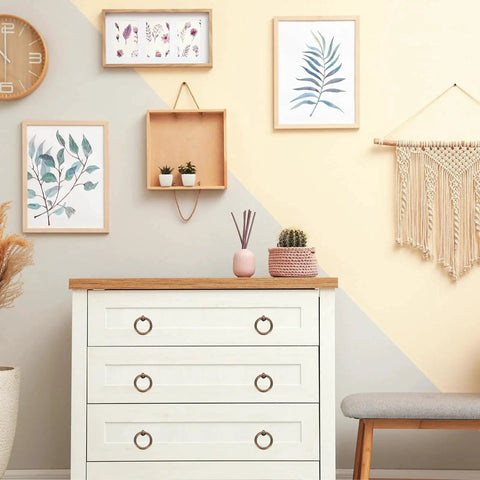 Dresser with Brass Ring Drawer Pulls Set 2 Pieces 0.79 Inch Gold Tone, in a decorated room with artwork and plants.