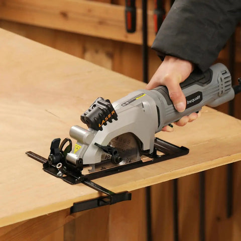 Powerful Corded Four Amp Circular Saw With Laser Guide And Bevel Cuts cutting wood on workbench, showing side view