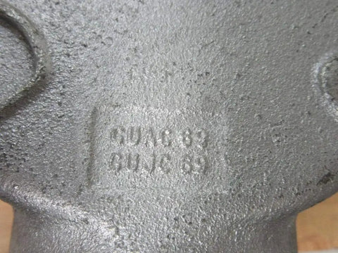 Close-up of Crouse Hinds explosion proof junction box GUAC69 for hazardous locations, showing rugged metal surface and markings.