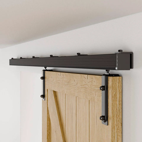 Wall-mounted 6.6Ft Box Rail Sliding Barn Door Hardware Kit Alloy Steel with ball bearing rollers installed above wood door