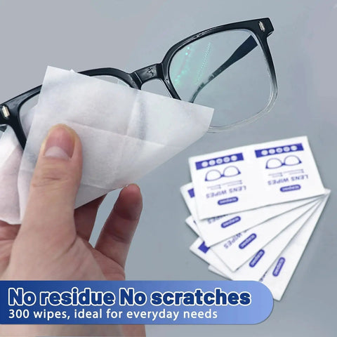 Person cleaning glasses with Lens Wipes for Eyeglasses Pre-Moistened 500 Count Streak-Free Cleaner, packets shown.