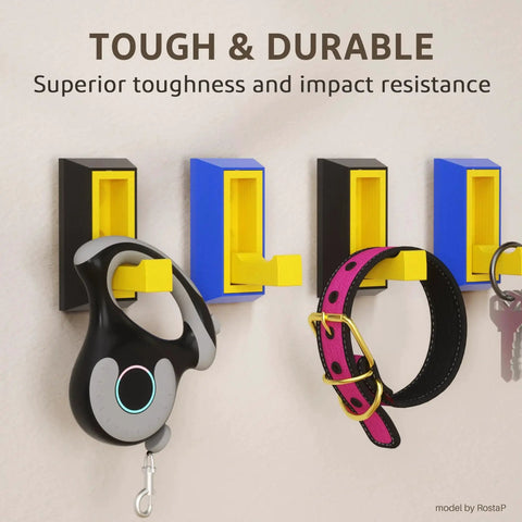 Plastic wall hooks holding a dog leash and collar, demonstrating toughness and impact resistance.