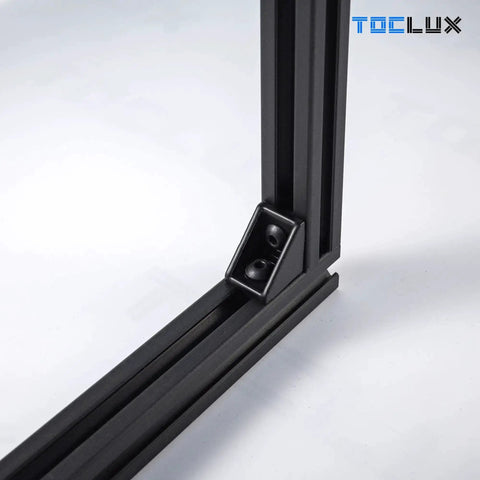 Black 2020 Corner Bracket Kit for 2020 and 2040 Aluminum Extrusion Rail shown in frame assembly