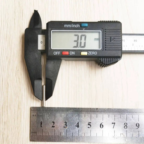 Close-up of caliper measuring 3mm, used for 100 Pieces 3mm x 18mm Stainless Steel Dowel Pins For Shelf Support And Cabinet Fastening Rust Resistant Dowel Pins With Centerless Ground Finish Heavy Duty Metal Fasteners For DIY Projects.