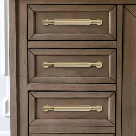Ten Pack 5 Inch Satin Brass Cabinet Pulls Heavy Duty Brushed Brass Handles on wooden drawer in kitchen