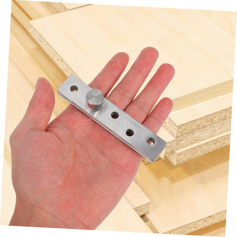 Heavy Duty Concealed Door Pivot Hinge In Stainless Steel Rotatable Hidden Hinge for cabinet and bookcase doors displayed in hand