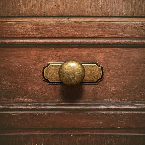 Retro Antique Brass Zinc Alloy Cabinet Knob With Backplate installed on wooden drawer, distressed metal hardware, durable corrosion resistance