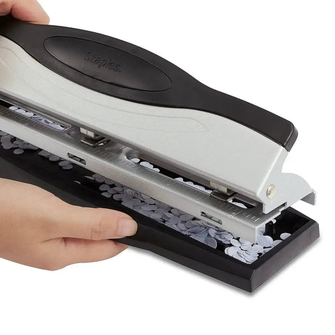 Heavy Duty 3 Hole Punch For Office Paper, sleek black and silver finish, shown with punched paper holes, durable metal construction.