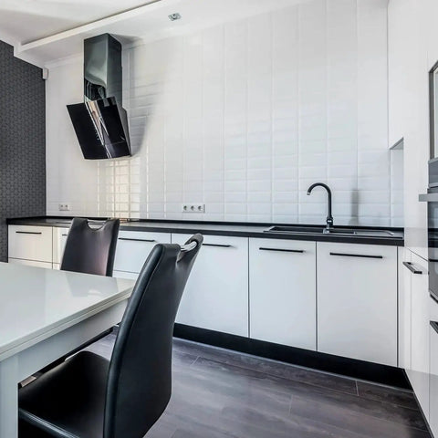 Modern kitchen with matte black 10 inch square cabinet pulls for kitchen cabinets and drawers, sleek white and black design.