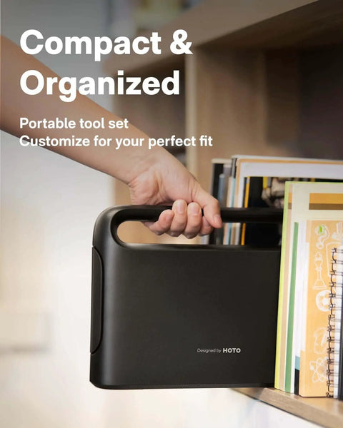 Person placing a black portable tool case with handle on a shelf, labeled 'Designed by HOTO,' for 40 Piece Tool Kit With Smart Electric Screwdriver LED Light And Three Torque Settings For Home Repairs And DIY Projects Pro Grade Compact Organizer For Dorms And Quick Fixes.