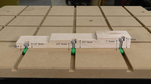 Wood fixture with screws and stock labeled on wood platform, showcasing use of Zeroplay Two Step Plunge Router Bit With Half Inch Shank.