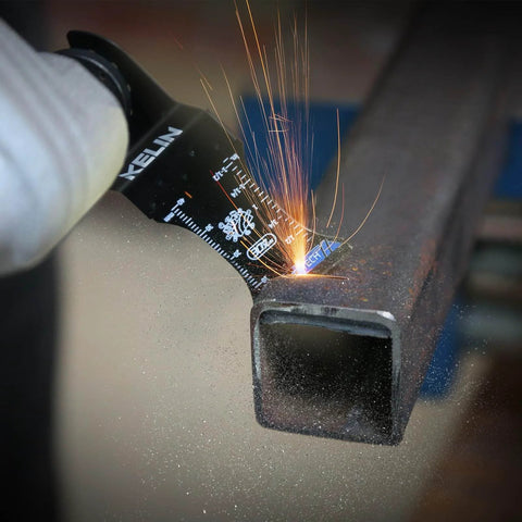 Six Piece Carbide And Titanium Multitool Blades Kit cutting metal, sparks visible, close-up of oscillating tool in action