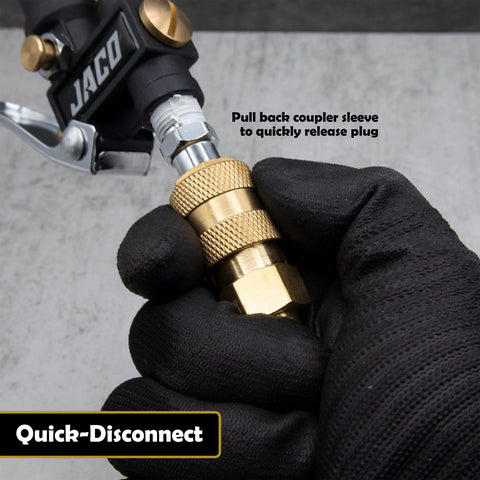 JACO Hi-Flo quick-connect air hose fittings, brass plug/coupler, 1/4 in NPT, set of 12, held by gloved hand